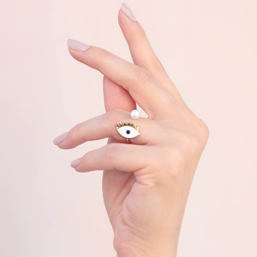 Hand painted enamel gold plated eye ring with pearl worn on finger